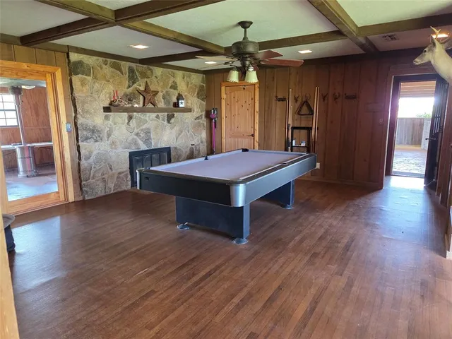 a room with wooden floors and window