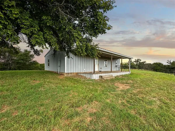 a house view with swimming pool in front of it