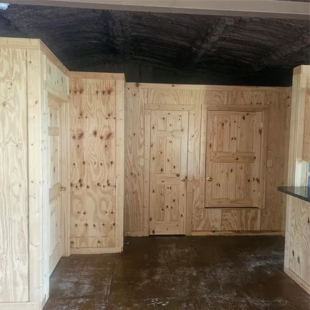 a kitchen with granite countertop a sink and a stove