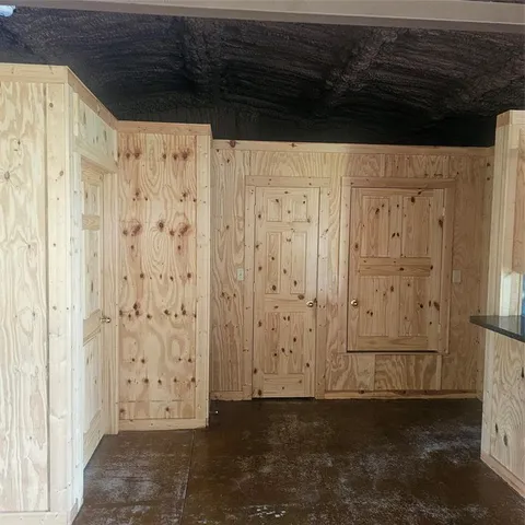 a kitchen with granite countertop a sink and a stove