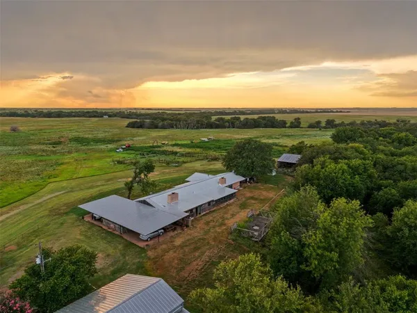 an aerial view of a house with ocean view