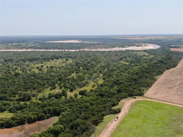 an aerial view of residential building and lake