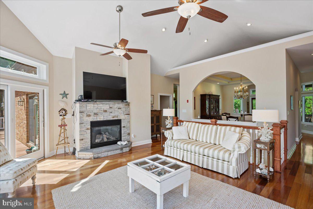 45216 Clarkes Landing Road Hollywood, MD 20636 - Photo 36 of 81 a living room with furniture fireplace and flat screen tv