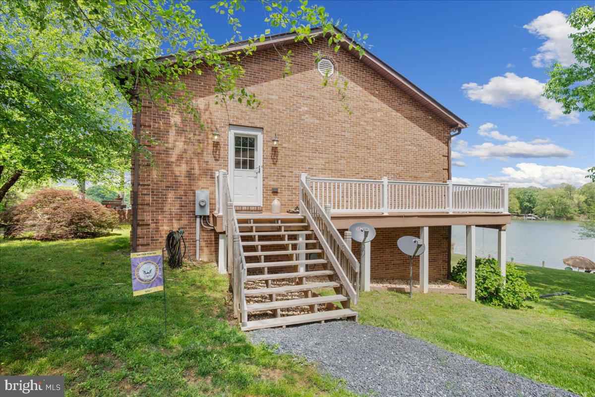 45216 Clarkes Landing Road Hollywood, MD 20636 - Photo 64 of 81 front view of a house with a yard