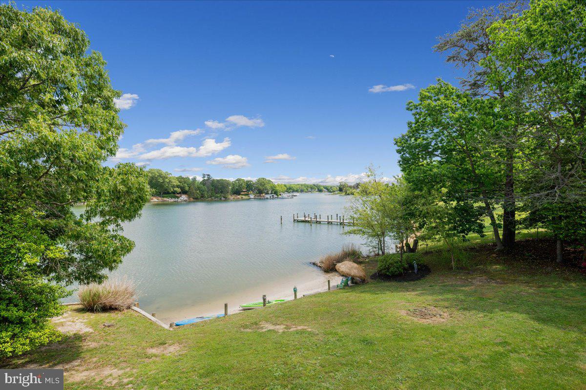 45216 Clarkes Landing Road Hollywood, MD 20636 - Photo 7 of 81 a view of a lake with a house in the background