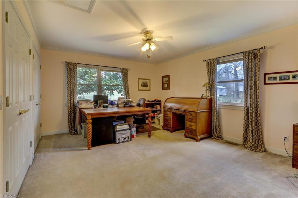 647 Simpson-Calhoun Road Greensboro, NC 27455 - Photo 13 of 30 Adjoining the master is the flexible room. This room has double closets, and makes are PERFECT nursery or office. Since the access is through the master it is not listed as a bedroom.