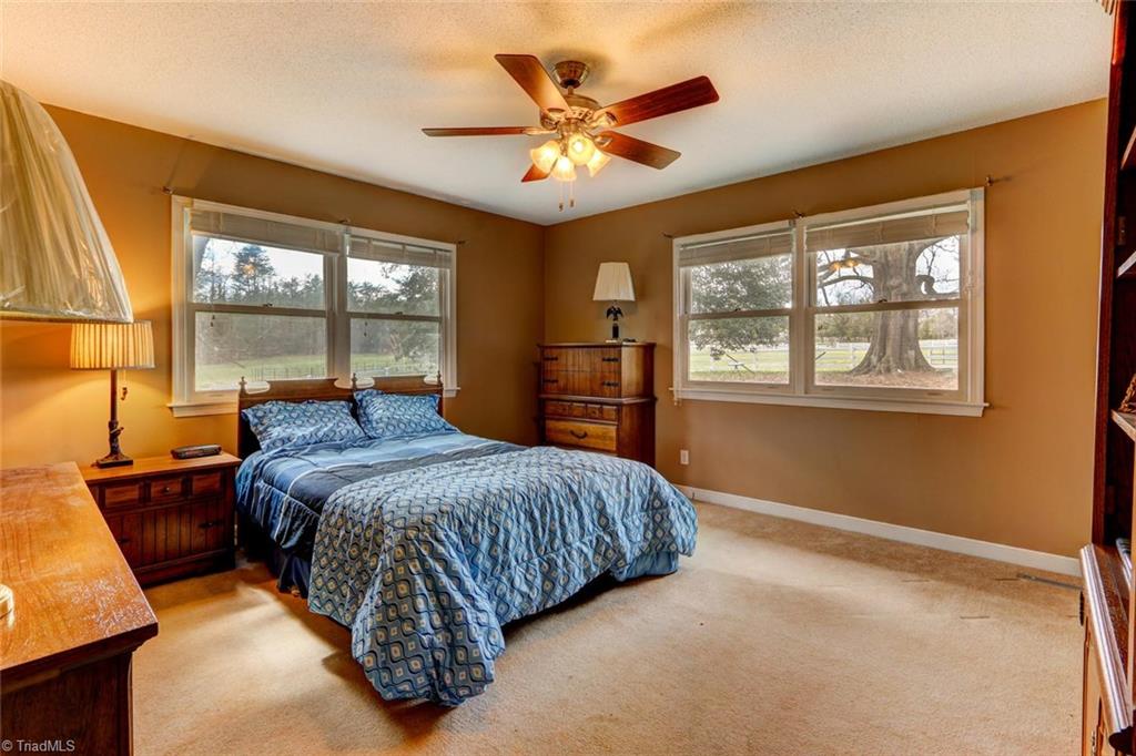 647 Simpson-Calhoun Road Greensboro, NC 27455 - Photo 17 of 30 Bedroom #2 also overlooks the pastures and the large old oak tree!