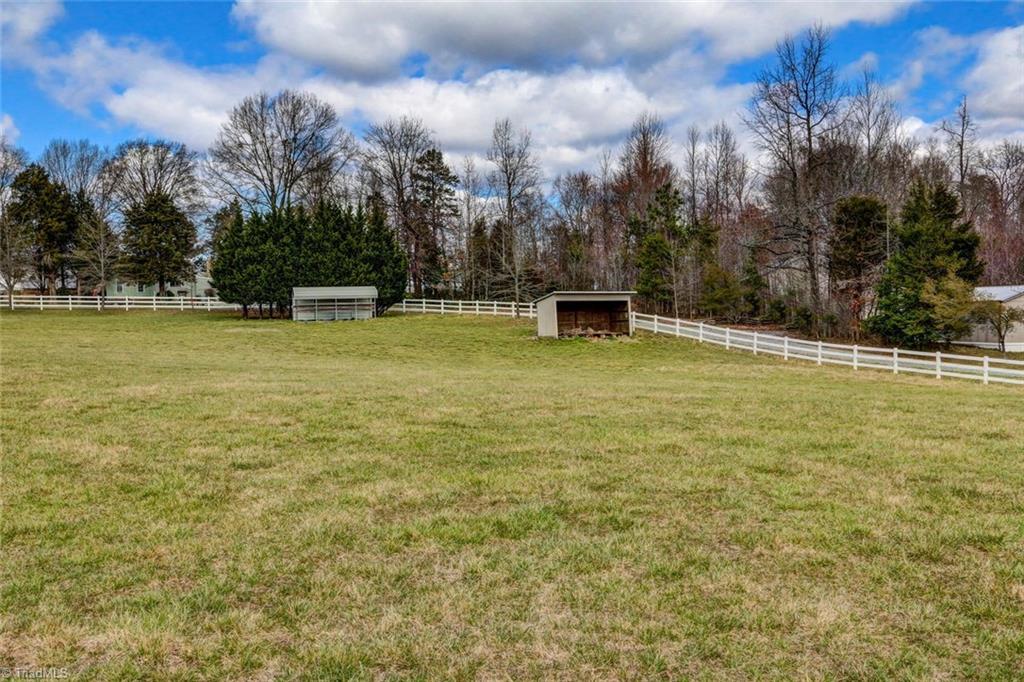 647 Simpson-Calhoun Road Greensboro, NC 27455 - Photo 22 of 30 Another pasture view. Also a round pen is included.