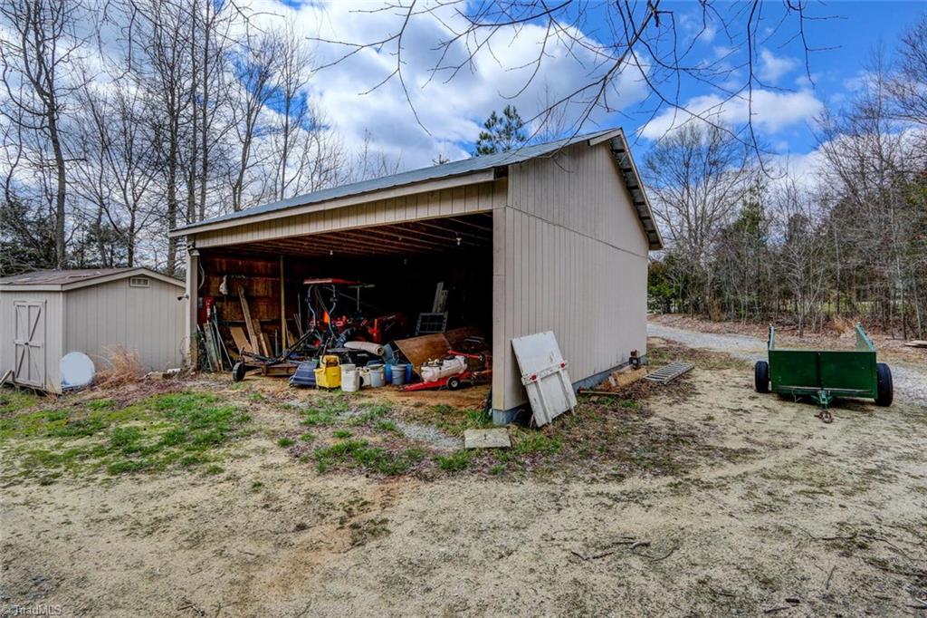 647 Simpson-Calhoun Road Greensboro, NC 27455 - Photo 24 of 30 Tractor shed.