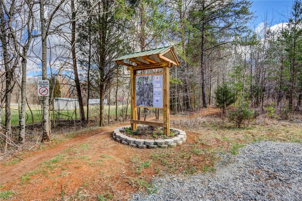 647 Simpson-Calhoun Road Greensboro, NC 27455 - Photo 28 of 30 You can see the barn on the left and the close proximity to the walking and hiking trail that will lead all the way into Greensboro in the future.