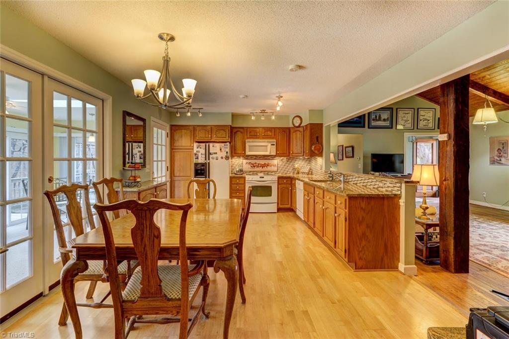 Updates to the kitchen include adding granite countertops and a custom designed tile backsplash.