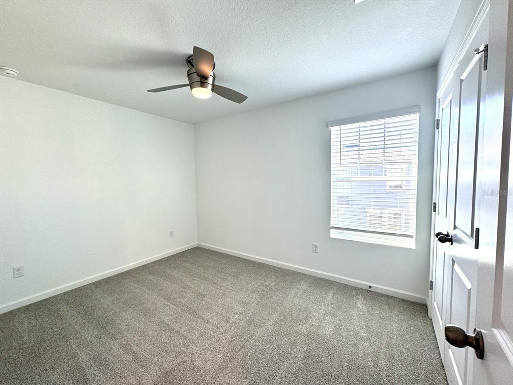 1025 Spring Palms Loop Orlando, FL 32828 - Photo 6 of 9 an empty room with a window