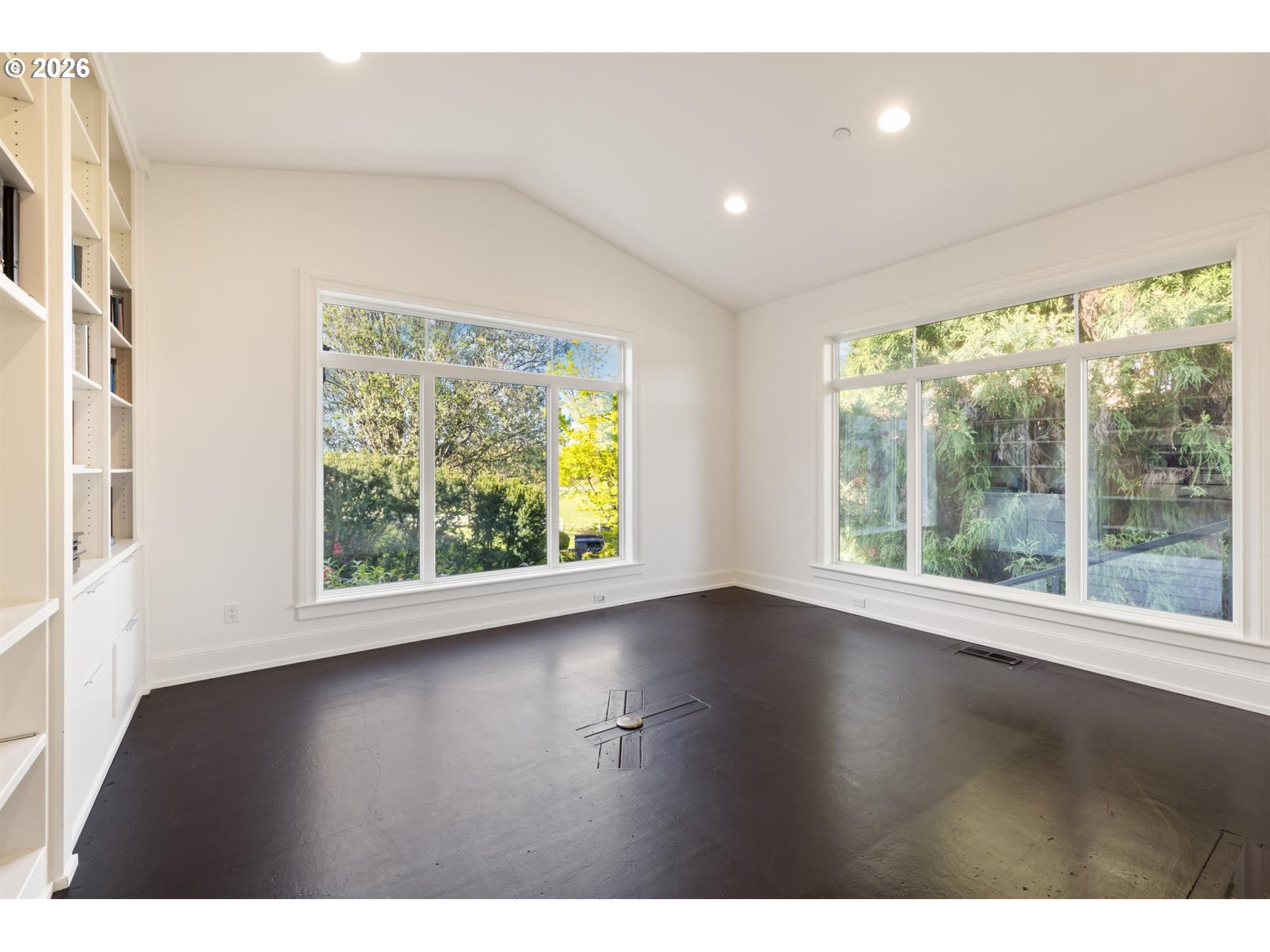 19600 Northwest 55th Avenue Ridgefield, WA 98642 - Photo 17 of 48 a view of an empty room with wooden floor and a window