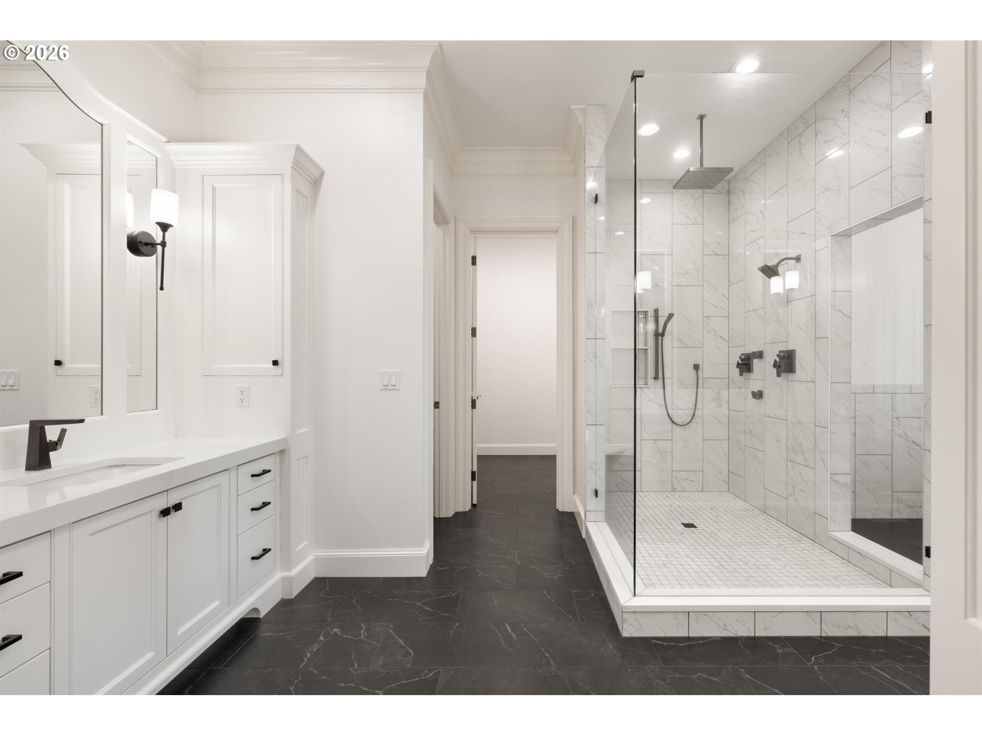 19600 Northwest 55th Avenue Ridgefield, WA 98642 - Photo 21 of 48 a bathroom with a shower sink and mirror