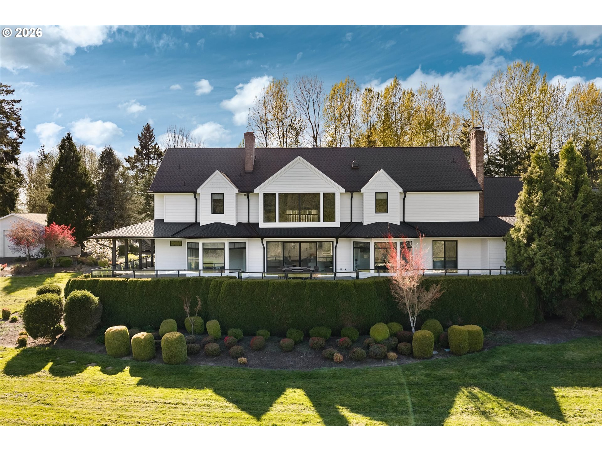 19600 Northwest 55th Avenue Ridgefield, WA 98642 - Photo 4 of 48 a front view of a house with garden