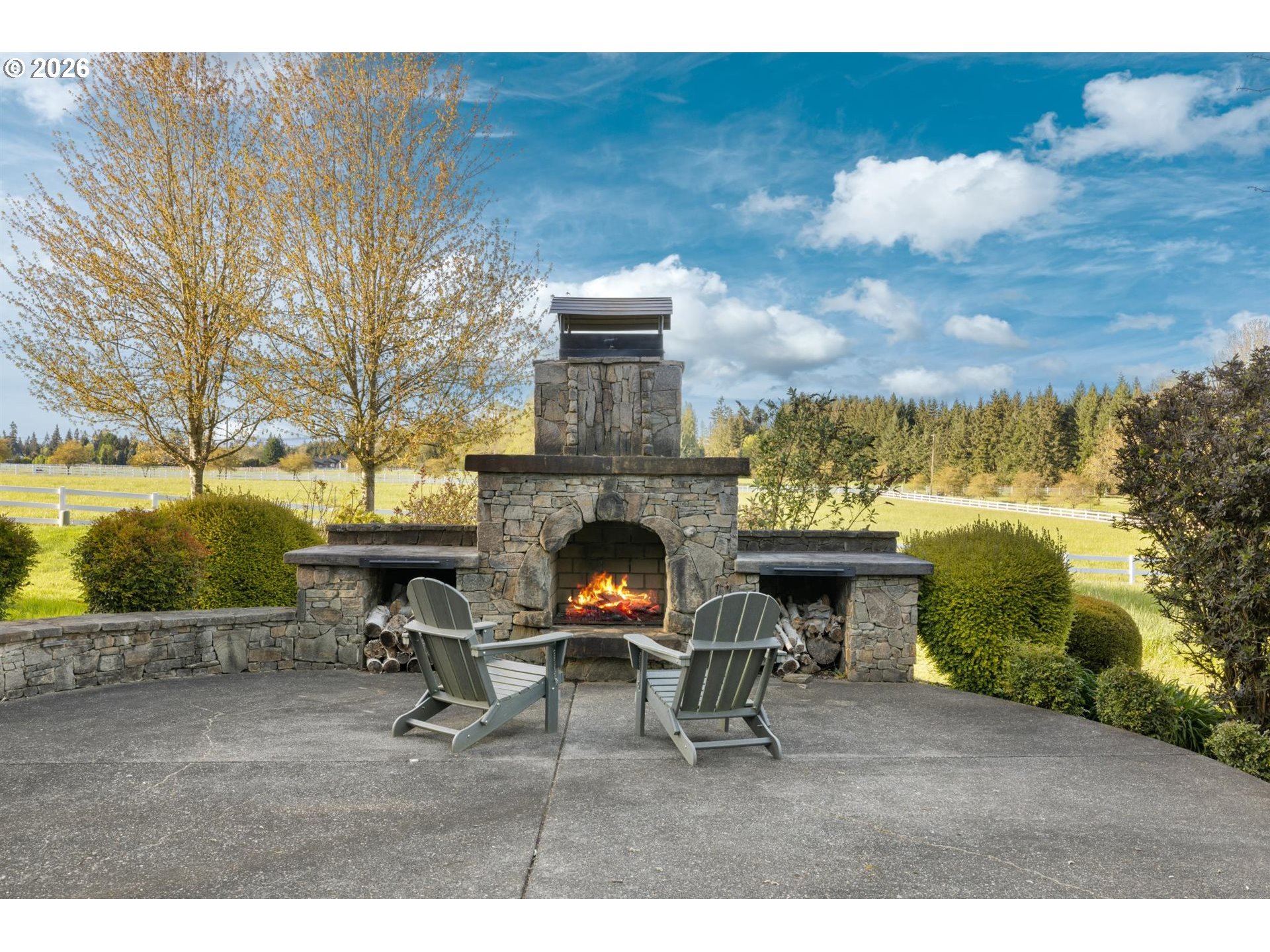 19600 Northwest 55th Avenue Ridgefield, WA 98642 - Photo 46 of 48 a view of a yard with furniture and a fire pit