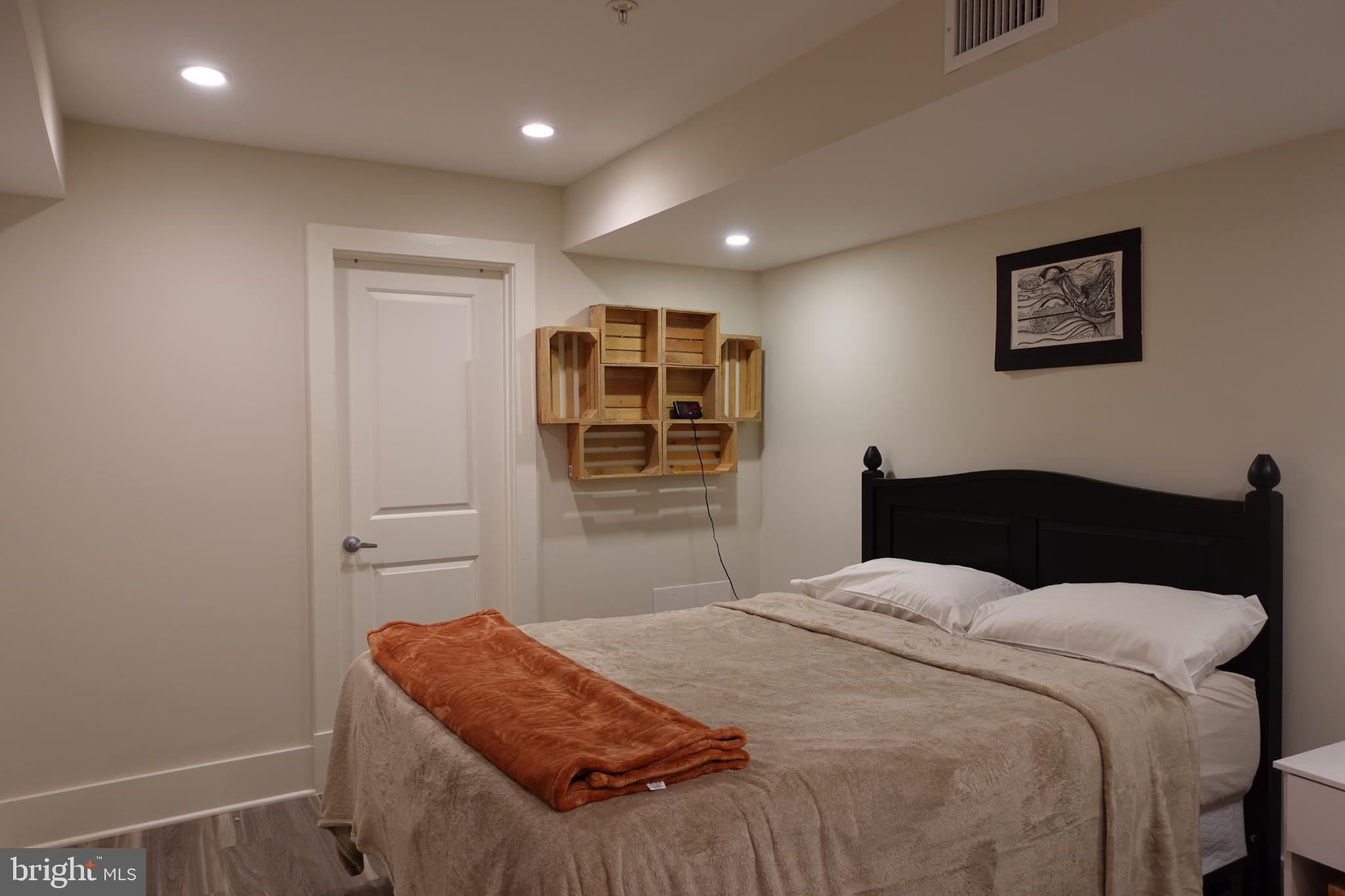 34 Channing Street Northwest, Unit 1 Washington, DC 20001 - Photo 10 of 18 a bedroom with a bed and a window