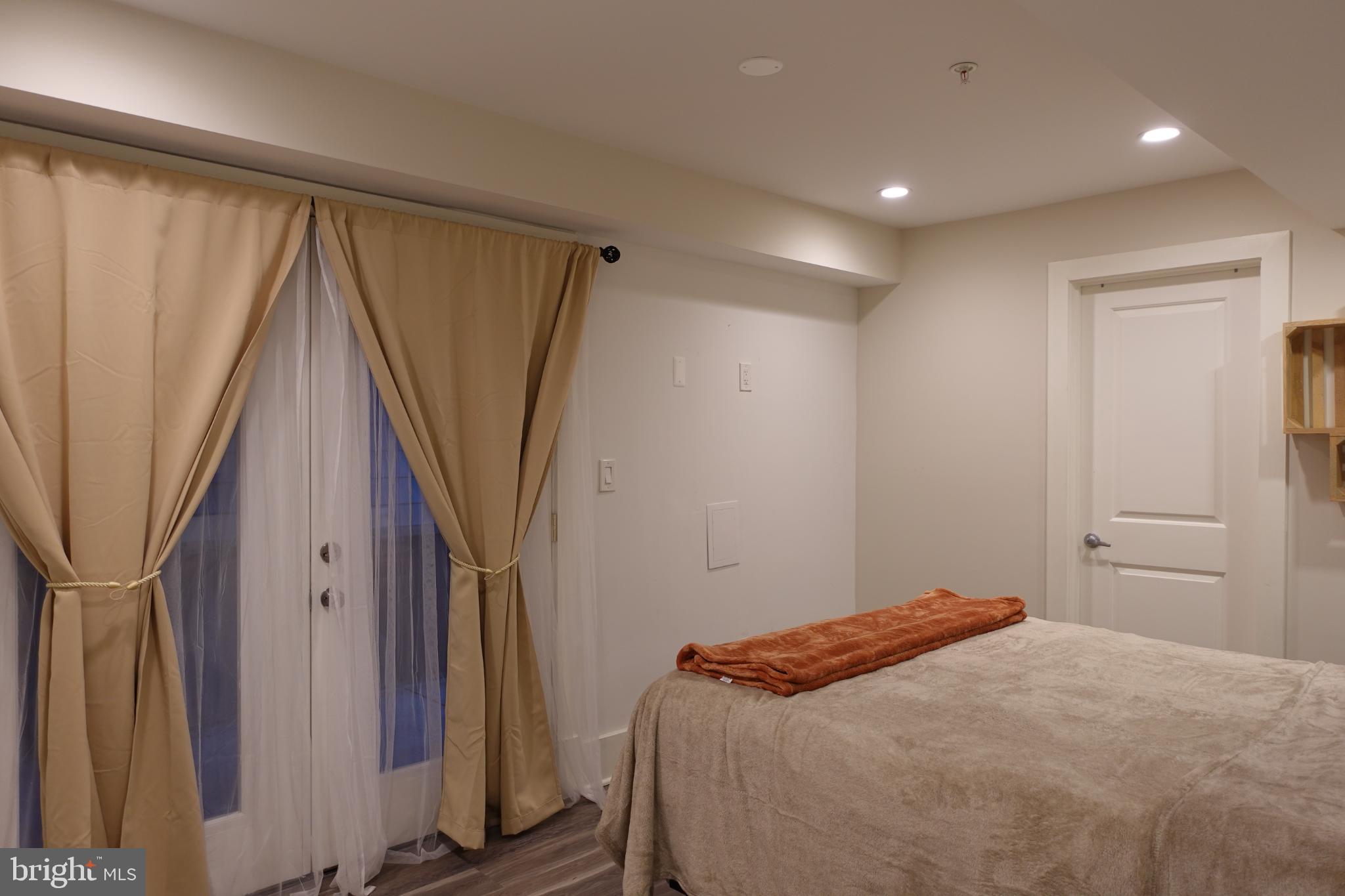 34 Channing Street Northwest, Unit 1 Washington, DC 20001 - Photo 10 of 18 a bedroom with a bed and a window