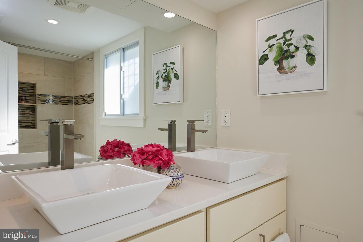 34 Channing Street Northwest, Unit 1 Washington, DC 20001 - Photo 12 of 18 a white bath tub sitting next to a white sink