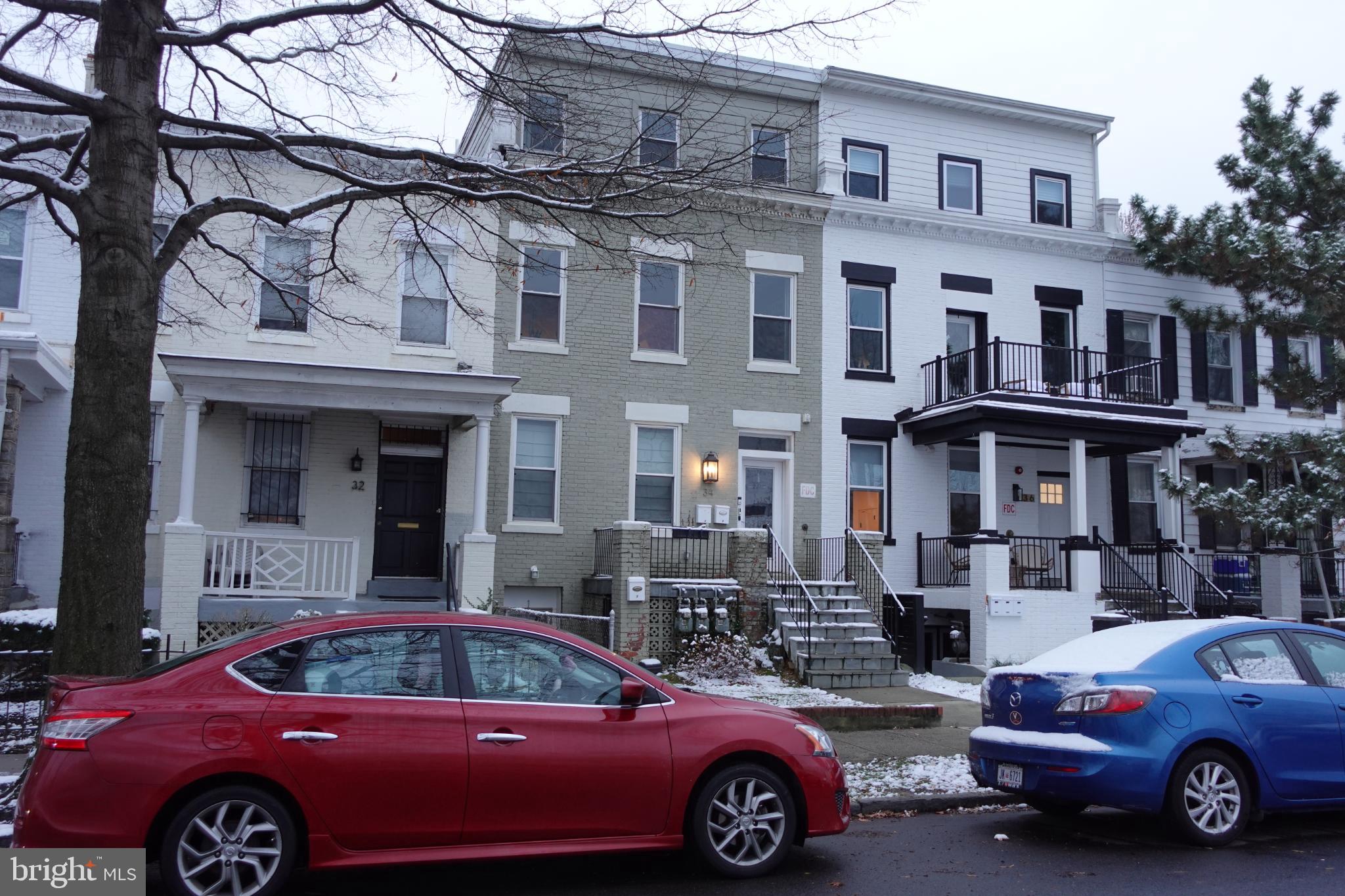 34 Channing Street Northwest, Unit 1 Washington, DC 20001 - Photo 17 of 18 a front view of a house with parking space