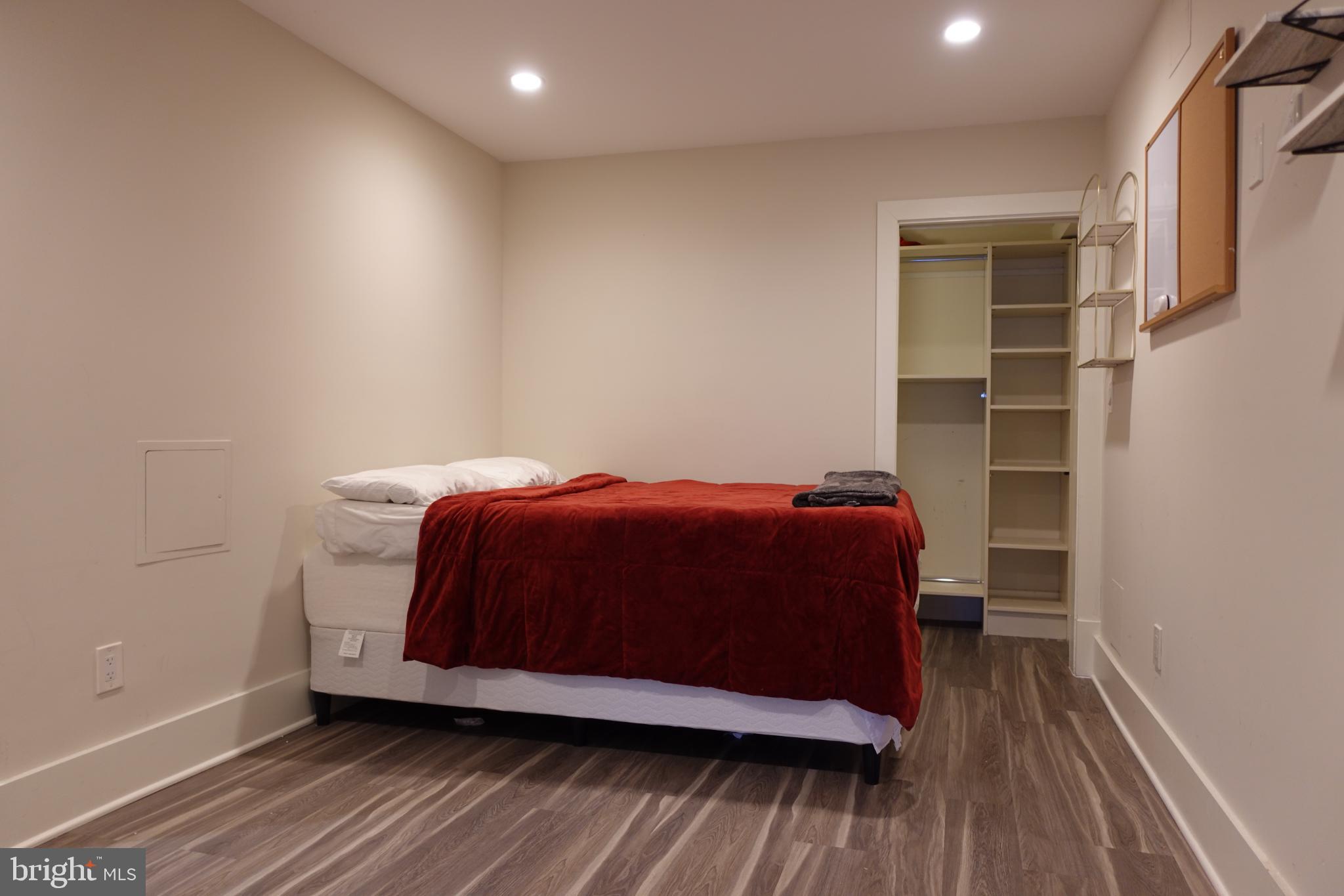 34 Channing Street Northwest, Unit 1 Washington, DC 20001 - Photo 6 of 18 a bed sitting in a bedroom next to a window