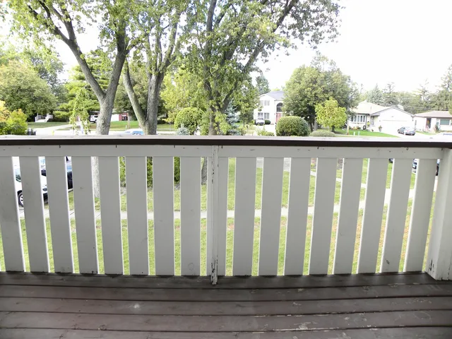 a view of a garden from a balcony