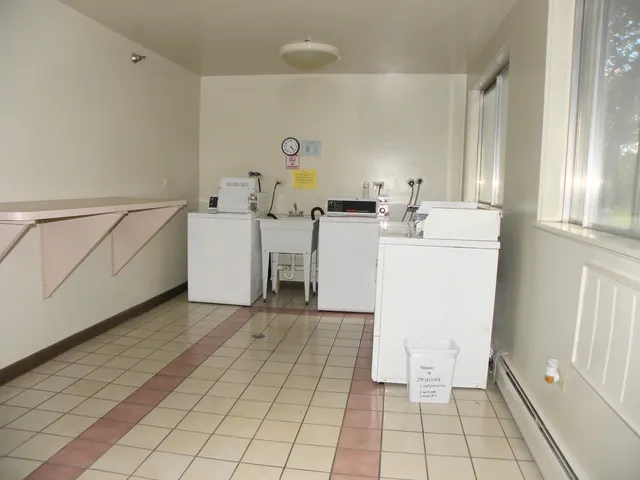 a view of a building with a yard