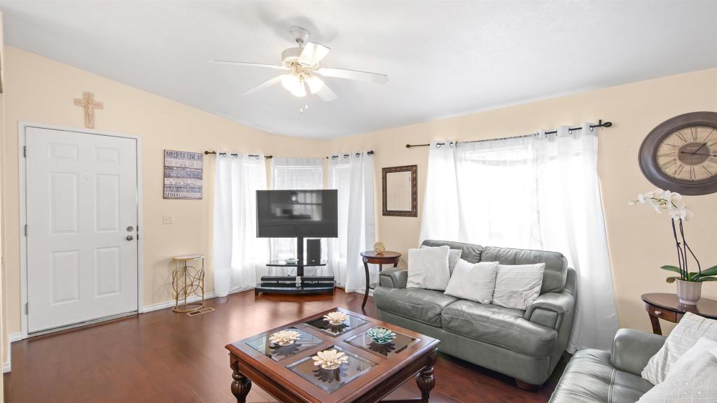 1455 Alturas Road, Unit 55 Fallbrook, CA 92028 - Photo 12 of 31 a living room with furniture a flat screen tv and a window