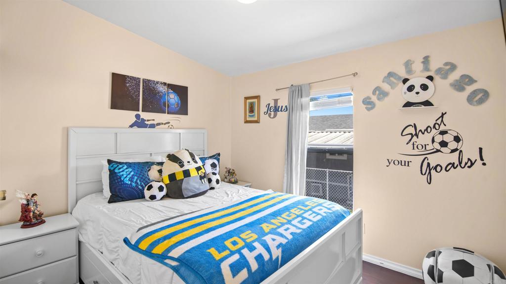 1455 Alturas Road, Unit 55 Fallbrook, CA 92028 - Photo 18 of 31 a bedroom with a bed and flat screen tv