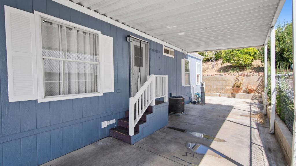1455 Alturas Road, Unit 55 Fallbrook, CA 92028 - Photo 24 of 31 a view of entryway with wooden floor and garden