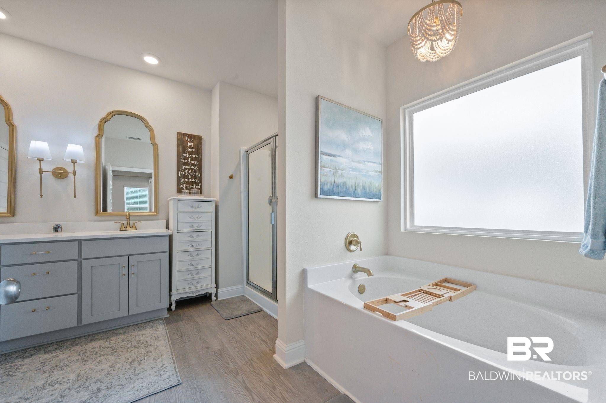 681 Calibre Street Fairhope, AL 36532 - Photo 33 of 56 Bathroom with a healthy amount of sunlight, wood-type flooring, shower with separate bathtub, and vanity