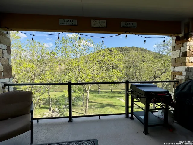a view of a swimming pool with a seating space