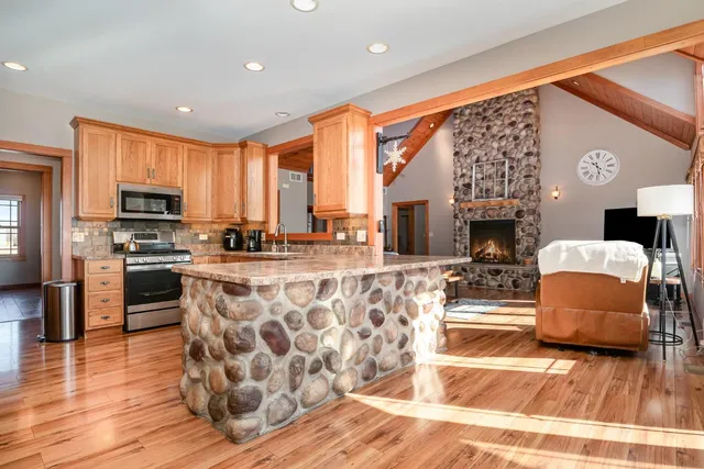 a living room with fireplace furniture and a flat screen tv
