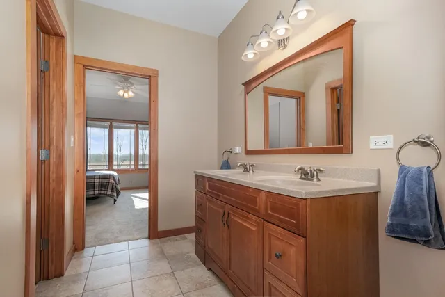 a bathroom with a double vanity sink and a mirror