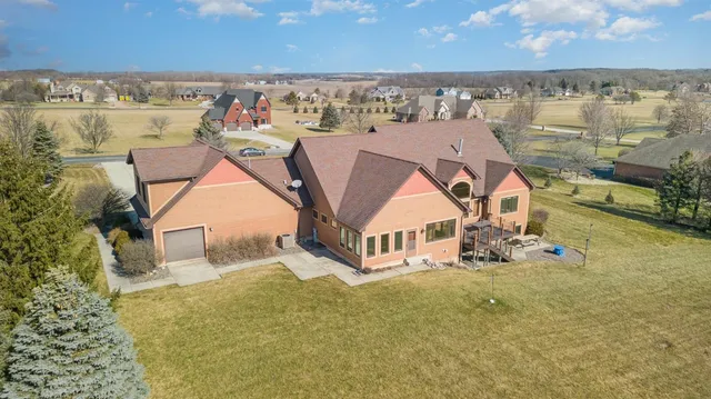 an aerial view of a house with a ocean view
