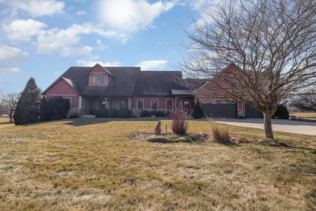 a swimming pool with outdoor seating and yard