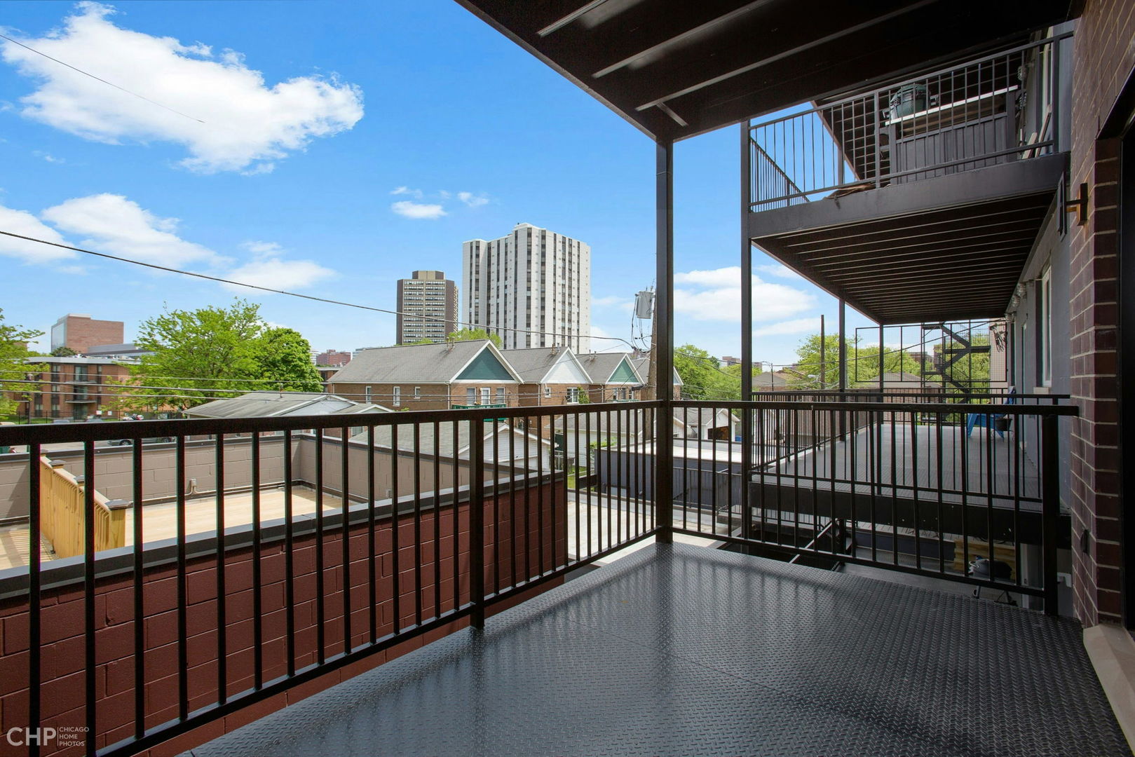 211 South Hamilton Avenue, Unit 2 Chicago, IL 60612 - Photo 14 of 16 a view of a balcony with wooden floor