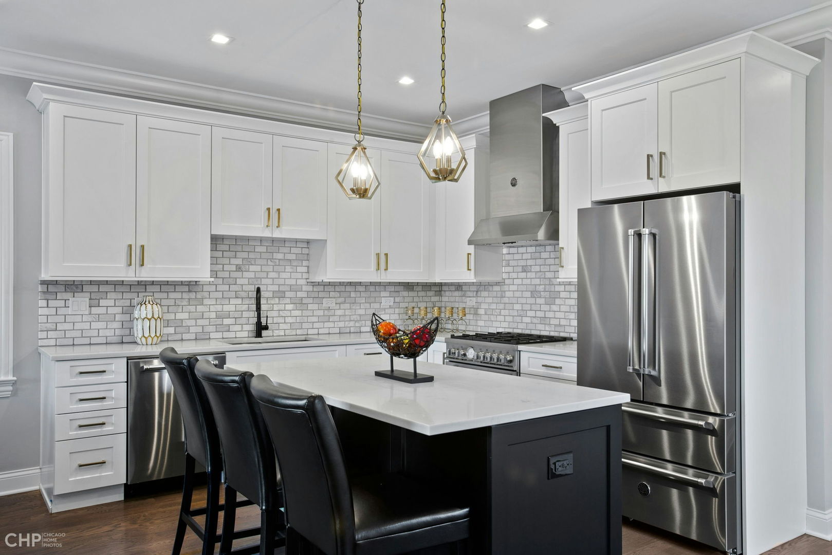 211 South Hamilton Avenue, Unit 2 Chicago, IL 60612 - Photo 3 of 16 a kitchen with stainless steel appliances granite countertop a sink a stove and a refrigerator