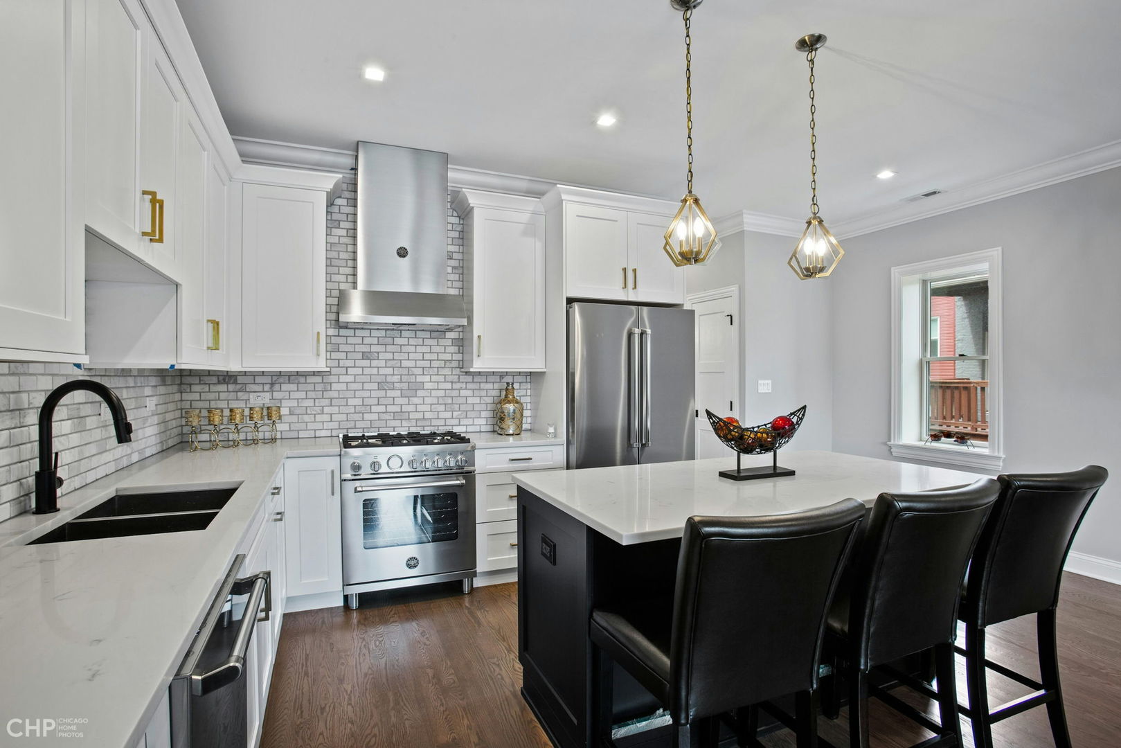 211 South Hamilton Avenue, Unit 2 Chicago, IL 60612 - Photo 6 of 16 a kitchen with a dining table and chairs