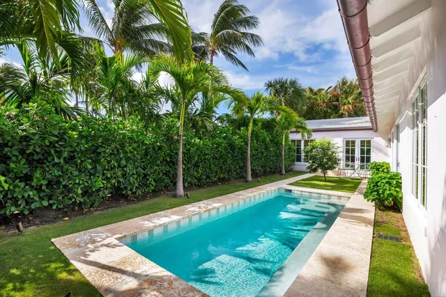 a view of swimming pool with a backyard