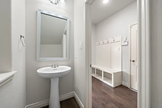 a bathroom with a sink a mirror and shower