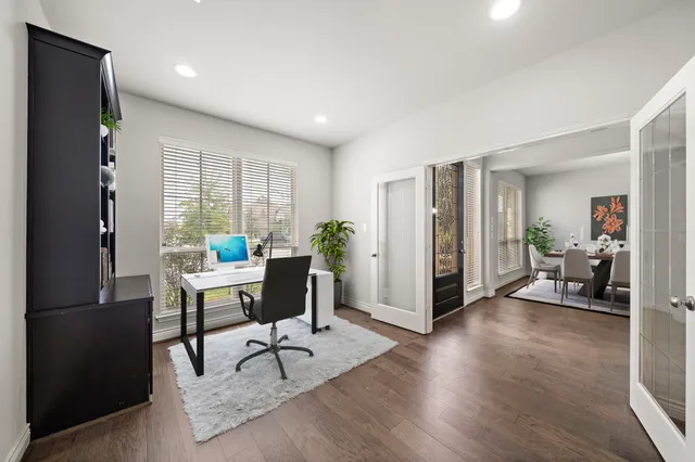 a livingroom with furniture and a potted plant