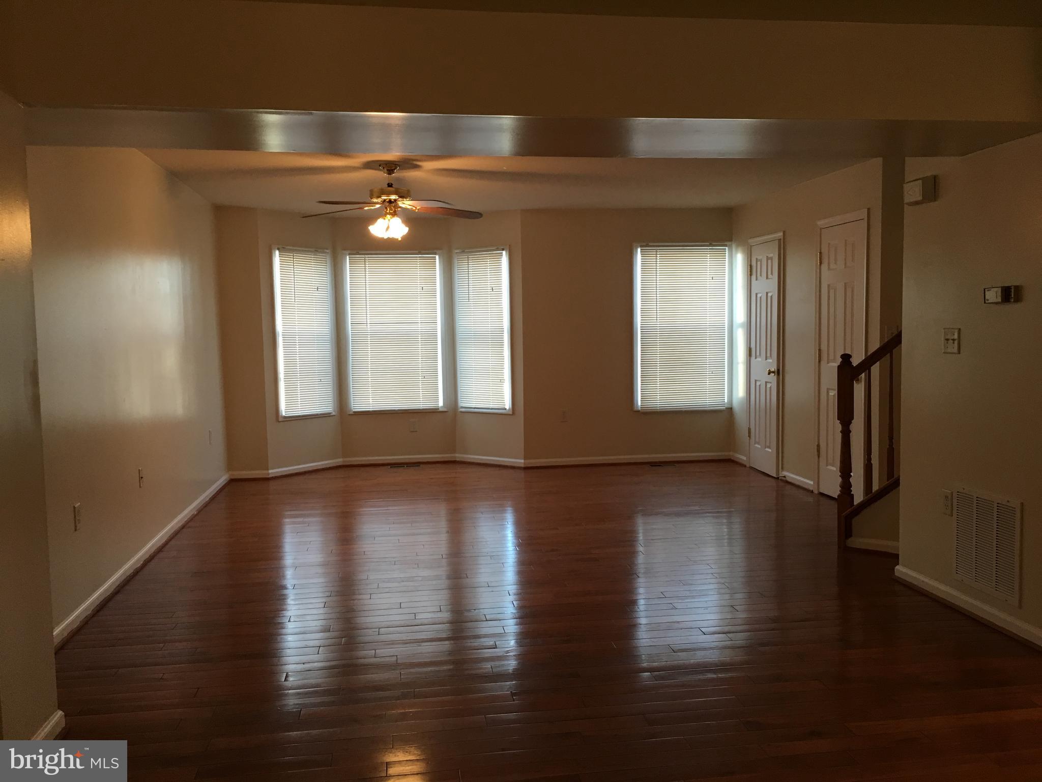 121 North Marshall Street Ranson, WV 25438 - Photo 5 of 16 Living Room offers hardwood flrs and new blinds.