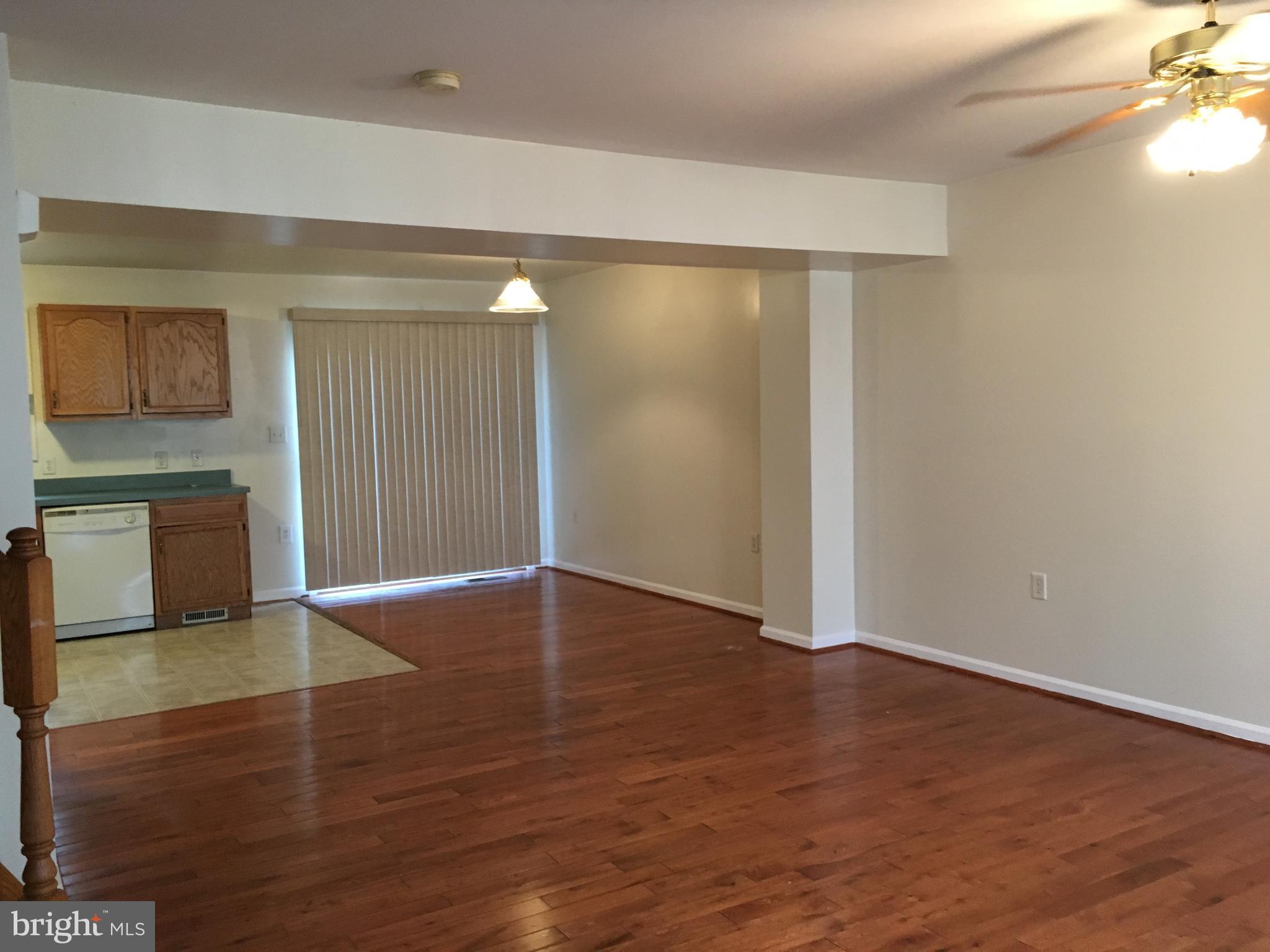 121 North Marshall Street Ranson, WV 25438 - Photo 6 of 16 Dining Room has hardwood floors leads to deck