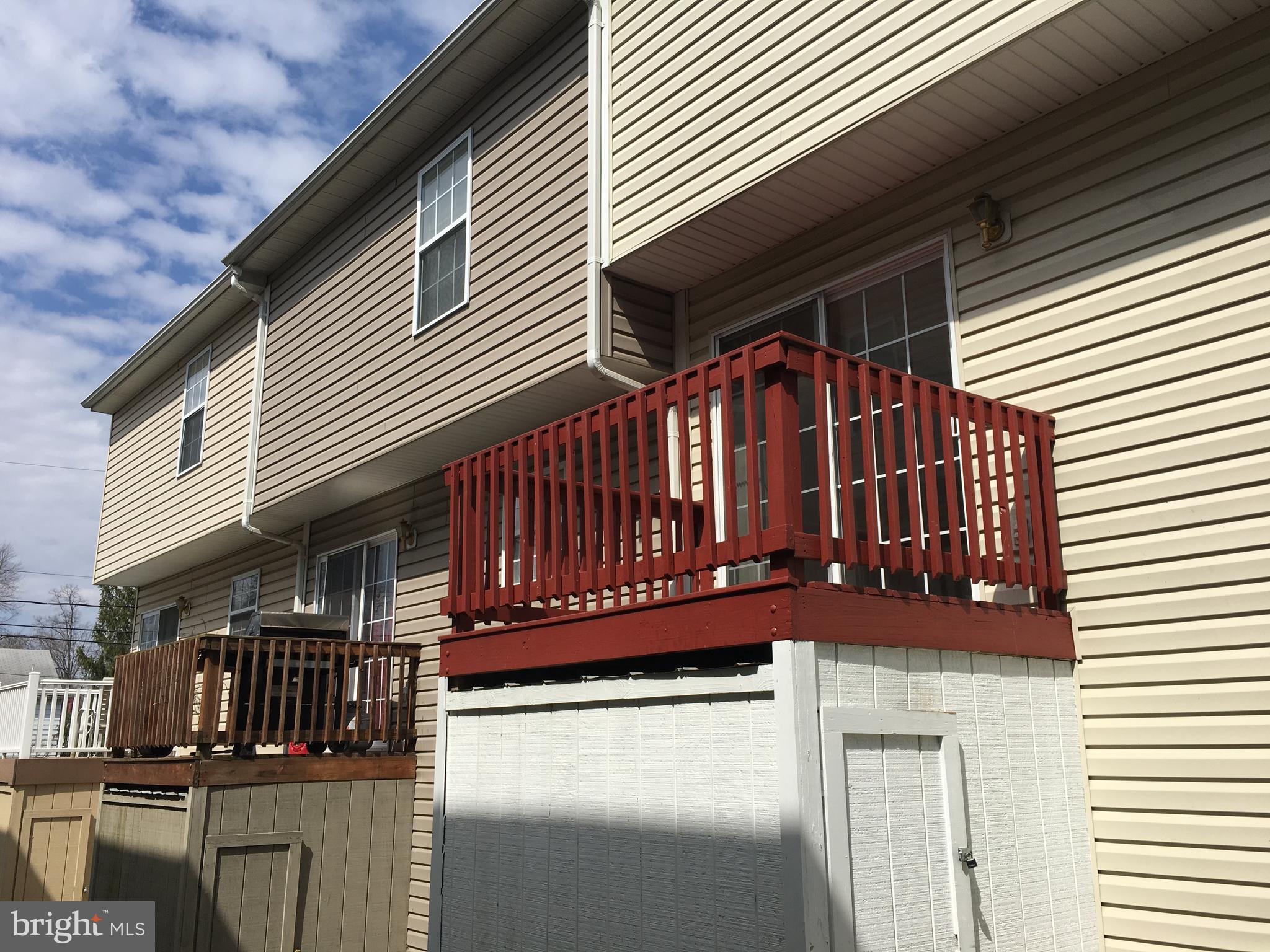 121 North Marshall Street Ranson, WV 25438 - Photo 8 of 16 Exterior (Rear) Deck w/ Storage Shed underneath.