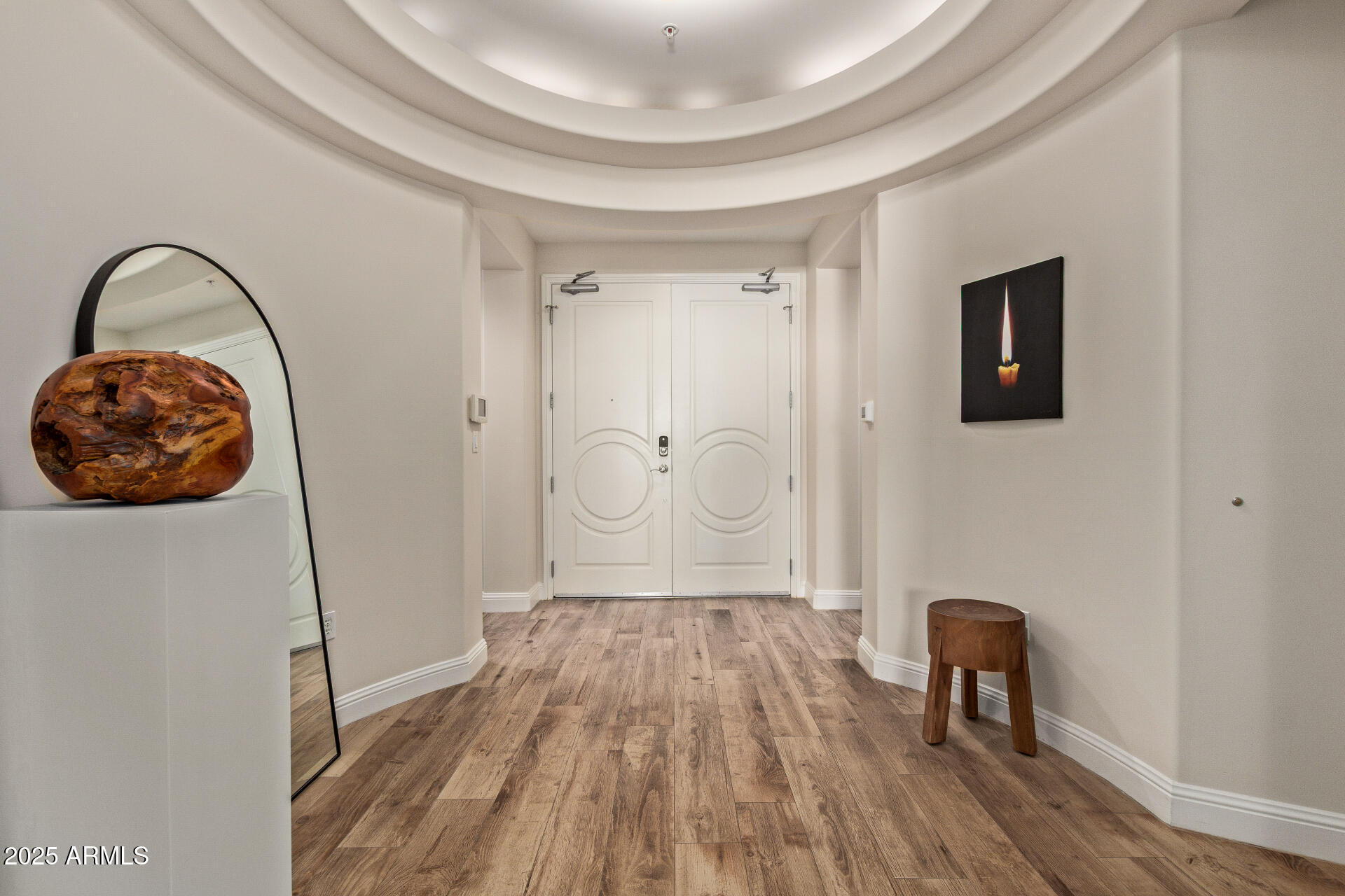 3801 North Goldwater Boulevard, Unit 302 Scottsdale, AZ 85251 - Photo 2 of 23 a view of a livingroom with furniture and wooden floor