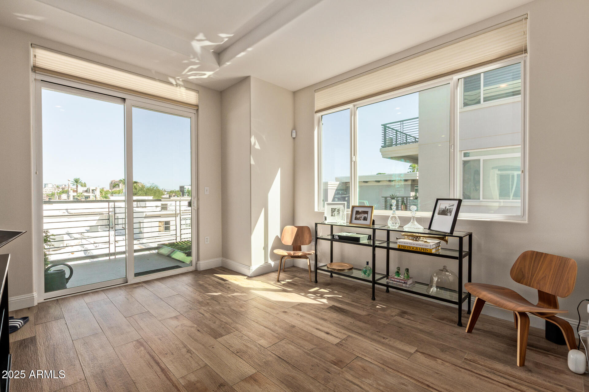 3801 North Goldwater Boulevard, Unit 302 Scottsdale, AZ 85251 - Photo 6 of 23 a view of a livingroom with furniture and a large window