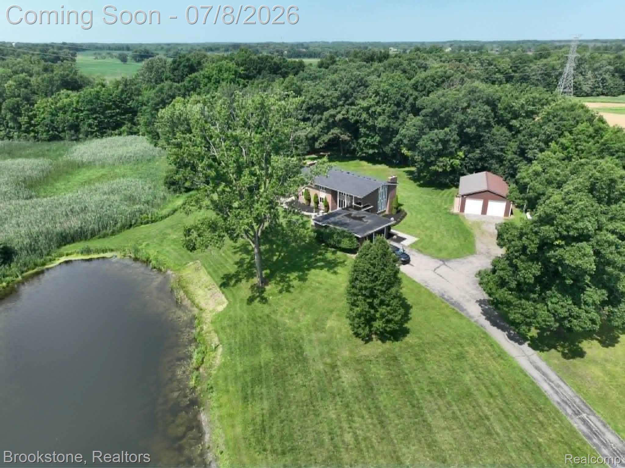 4140 South Henderson Road Davison, MI 48423 - Photo 11 of 98 Expansive property featuring a private pond, mature trees, and a detached two-car garage