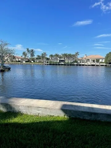 a view of a lake with a yard