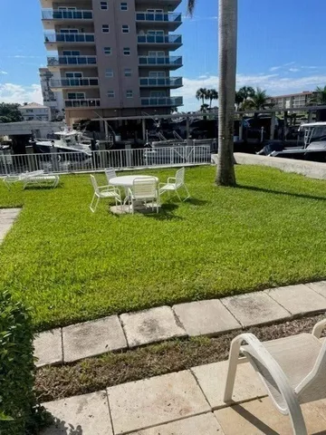 a view of a swimming pool with a lawn chairs